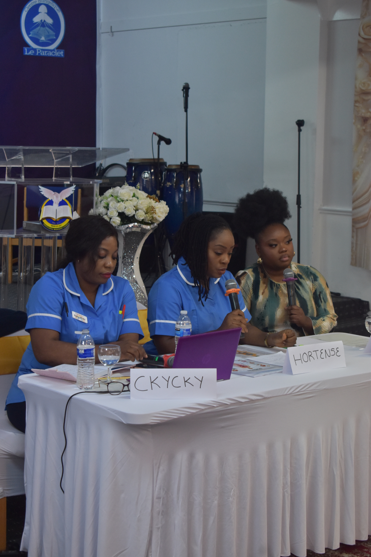 Registered nurses speaking at the Community Health Awareness Event in Leeds